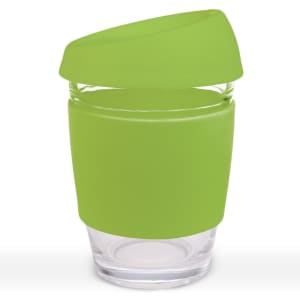 A reusable coffee cup with a transparent body and a bright green silicone lid and sleeve.