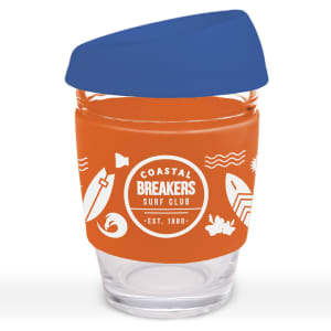 A reusable coffee cup with a blue silicone lid and an orange sleeve featuring a design related to surfing.