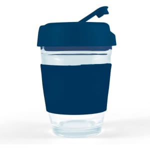 A reusable coffee cup with a transparent body, a navy blue silicone sleeve, and a flip lid.