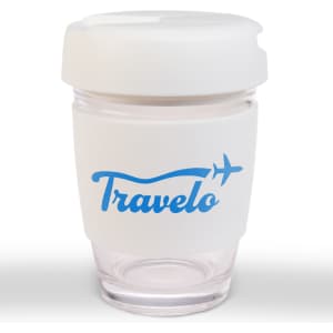 A reusable coffee cup with a flip lid, featuring a clear body and a white silicone sleeve, has a logo.