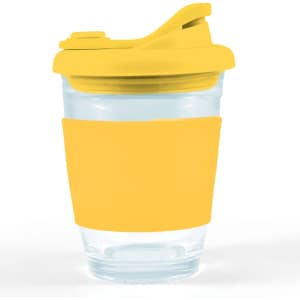 A reusable coffee cup featuring a clear body and a bright yellow silicone sleeve and snap lid.