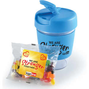 A blue reusable coffee cup with a lid and a packet of jelly beans featuring various colours. The cup has a logo.