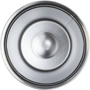 A stainless steel coffee cup with a smooth interior and circular base, reflecting light. It has a simple design.