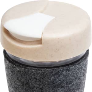 A reusable coffee cup with a textured band and a light-colored, lid featuring a sliding opening mechanism.