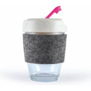 A reusable coffee cup featuring a transparent bottom, a textured gray band, and a light-colored lid with a pink straw.