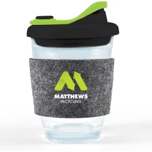 A reusable coffee cup with a clear body, black snap lid, and grey RPET band featuring a green logo.