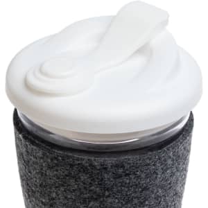 A reusable coffee cup featuring a clear body, a white snap lid, and a dark grey RPET band for insulation and grip.