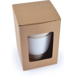 A reusable coffee cup packaged in a cardboard box with a clear window, featuring a silicone band around the base.