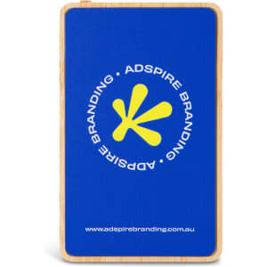 A bamboo power bank with a blue finish and a circular logo, featuring a yellow design inside.