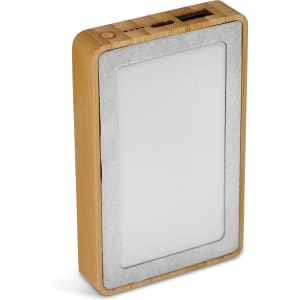 A rectangular power bank with a bamboo exterior and a white panel on the front, featuring USB ports and a logo.