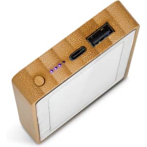 A bamboo power bank with a sleek design, featuring USB ports and LED indicators.