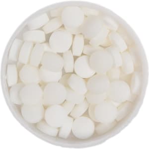A round tin filled with small, round white mint candies.