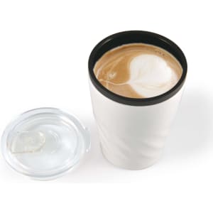 A reusable coffee cup in white with a black lid, featuring a latte art design on top.