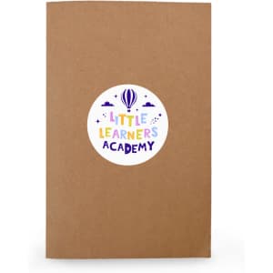 A brown notebook with a circular label featuring colourful text and a logo.