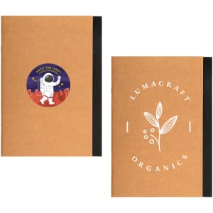 A brown A5 notebook featuring a space-themed sticker on one side and a botanical design on the other, with black binding.