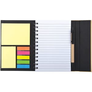 A black spiral-bound notebook with blank pages, sticky notes in yellow, blue, green, and pink, and a pen.