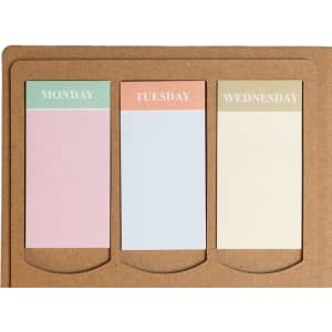 A planner with three colored tabs for Monday, Tuesday, and Wednesday, set against a brown kraft background.