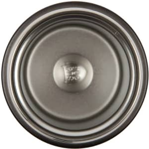 A double wall coffee cup in a stainless steel finish, featuring a smooth interior and a logo at the base.