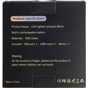 A black box containing product specifications for a LED compact mirror, including materials and included items.