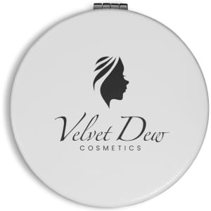 A round white compact mirror featuring a logo and an elegant design of a woman's profile.
