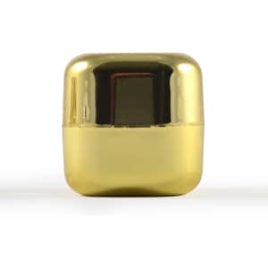 A gold-colored cube-shaped container of Ritz Cube Lip Balm, designed for health and personal care.