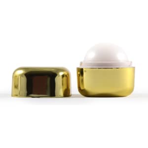 A gold container of Ritz Cube Lip Balm with a white balm inside, showcasing a sleek, shiny design.