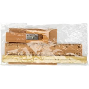 A stationery set featuring a wooden ruler, a pencil sharpener, and pencils, all packaged in a sealed plastic bag.