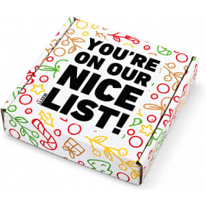 A gift box featuring festive designs in red, green, and gold, with a prominent black text message.