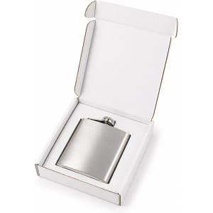 A silver hip flask is displayed inside an open white gift box, featuring a simple design and a logo.