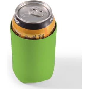 A drink can is nestled inside a bright green stubby cooler designed to keep beverages cold.