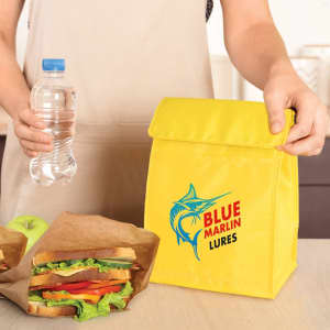 A yellow cooler lunch bag with a logo, alongside a water bottle and sandwiches in brown paper bags.