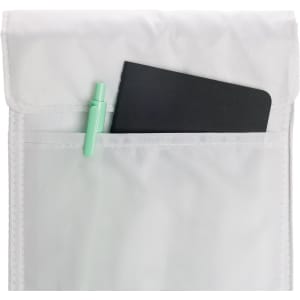 A white cooler lunch bag with a black notebook and a green pen peeking out of the pocket.