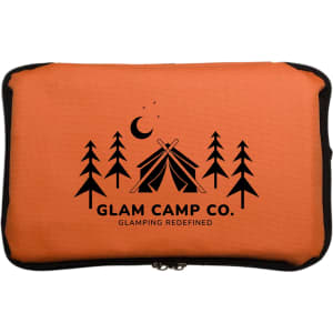 An insulated cooler bag in orange featuring the "GLAM CAMP CO." logo, adorned with tree and camping tent graphics.