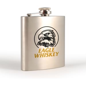 A stainless steel hip flask featuring a circular eagle design and a logo, finished in a polished metallic colour.