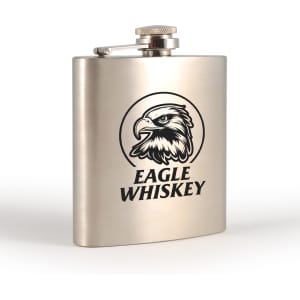 A stainless steel hip flask with a polished finish and an eagle logo on the front.