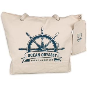 A beige canvas tote bag featuring a nautical steering wheel design and a small matching pouch.
