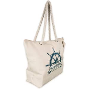 A cream canvas tote bag with a nautical design and rope handles. Features a logo on the front.
