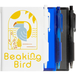 A pocket notebook in white with a bird design, accompanied by a blue pen, black pen, and a dark blue holder.