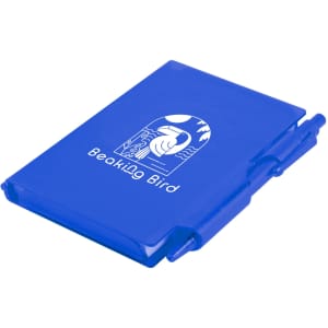 A blue Odyssey Pocket Notebook with a matching pen, featuring a design of a bird and a scenic background.