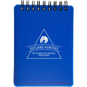 A blue spiral-bound notebook with a logo and a geometric design on the front cover.