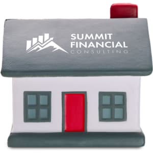 A house-shaped stress reliever in grey, white, and red, featuring a logo on the front.