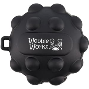 A black, round toy featuring raised bumps and a logo, designed with playful character details.