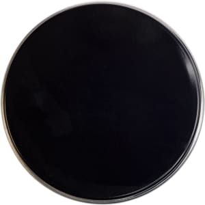 A petite candle in a sleek black tin container, designed for home living and ambiance enhancement.