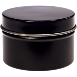 A petite black candle in a tin container with a smooth lid. The minimalist design features a sleek finish.
