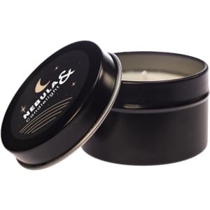 A black tin candle with an open lid, featuring a decorative label that includes stars and a crescent moon design.