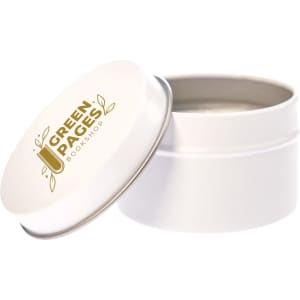 A petite candle in a white tin with a silver lid, featuring a logo that reads "Green Pages Bookshop."
