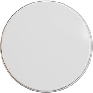 A petite candle in a smooth white tin container.