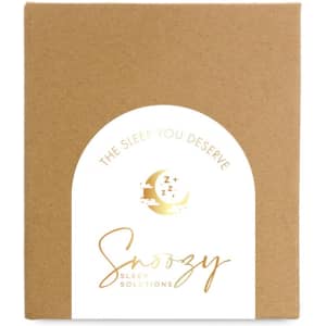 A brown cardboard box featuring a circular white label with gold graphics and text for "Snoozy Sleep Solutions."