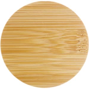 A round bamboo serving board featuring a smooth, natural finish.
