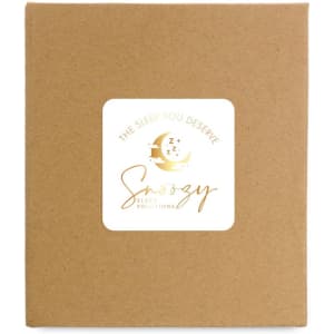 A brown cardboard box featuring a logo with gold accents and sleep-themed graphics.